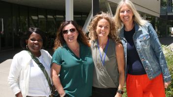 Four women smiling 