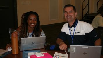 Two participants smiling