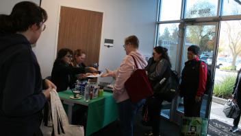 educators waiting in line at registration desk