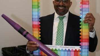 educator and with crayons and frame props