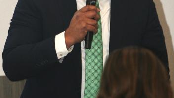 man speaking with microphone