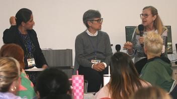 3 women speaking on a panel