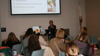 educators listening to presentation in conference room