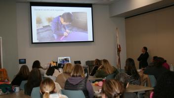 educators listening to presentation in conference room