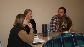 educators listening to presentation in conference room