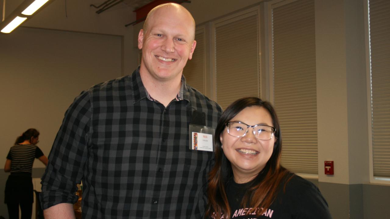 one man and one woman smiling for camera