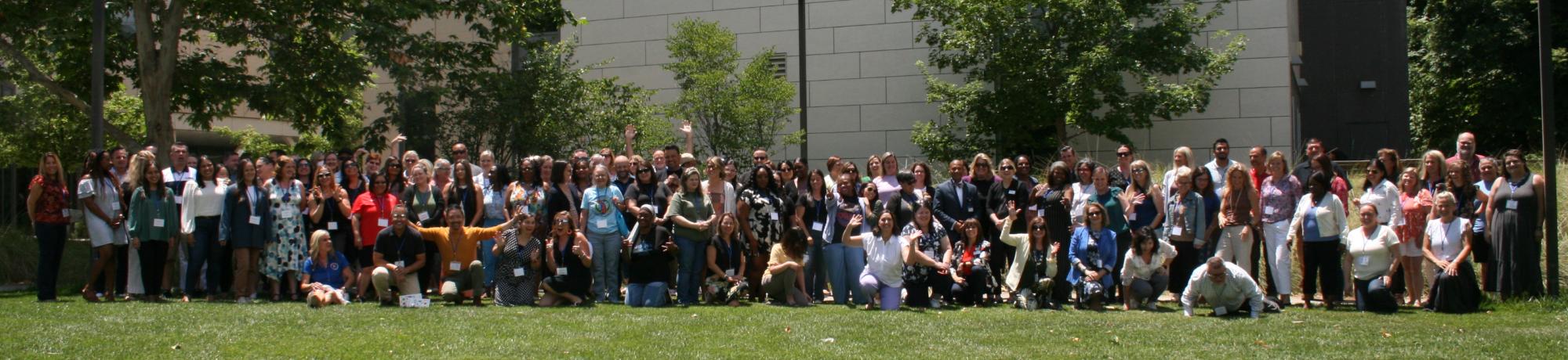 Participants in a line outside
